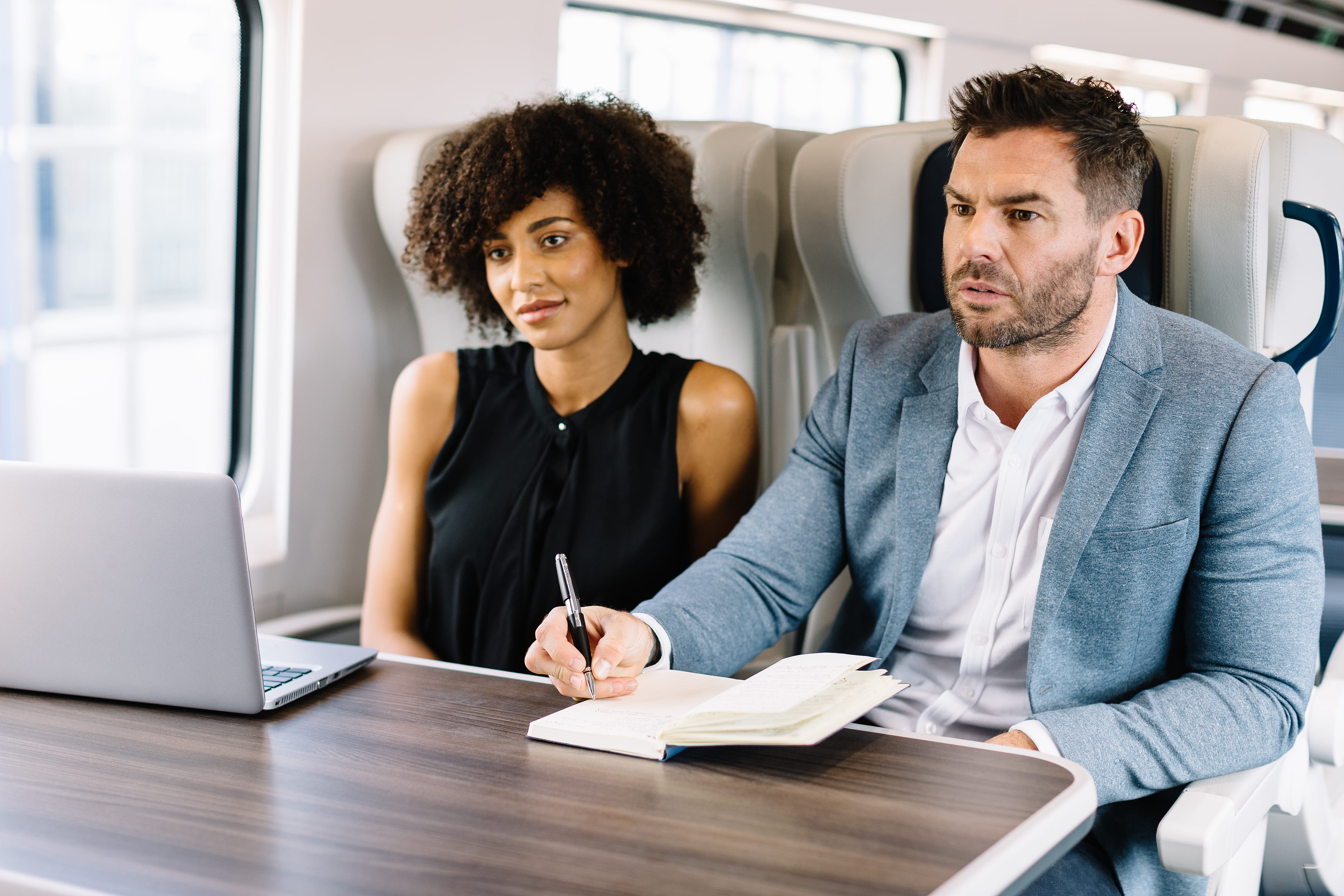 two colleagues working on the train